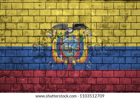 Ecuador flag is painted onto an old brick wall