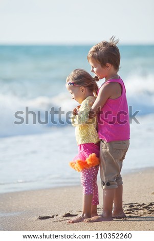 Children playing outdoors at the sea