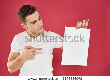  man showing finger on white blank sheet of paper seat free                              