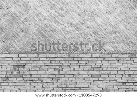 Concrete and brick texture. Even on the top half, and white stones on the bottom, separated . Pattern art and design concept photo