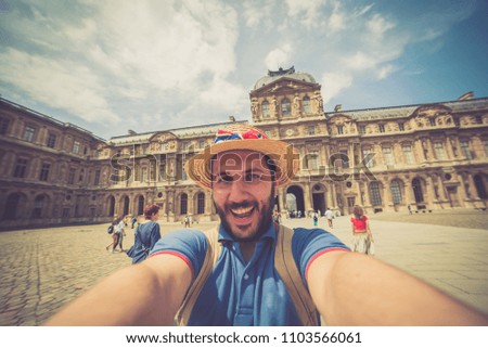 Tourism in Paris, France. handsome tourist taking selfie photo traveling in Europe capitals. Concept of fun, joy, discovering and love