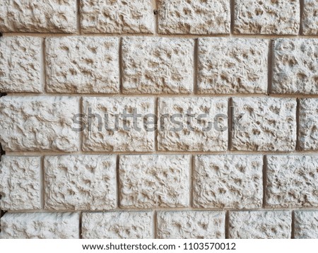 Stone wall pattern. Close up of big concrete bricks outside.
