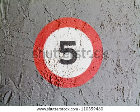 Speed limit sign painted on wall