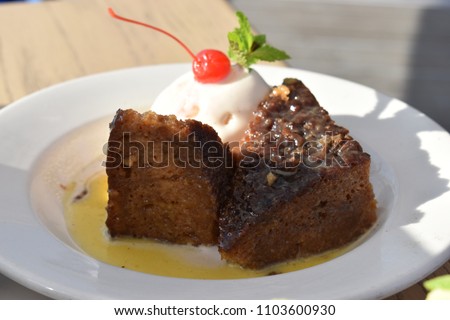 Delicious traditional South African Malva Pudding Royalty-Free Stock Photo #1103600930