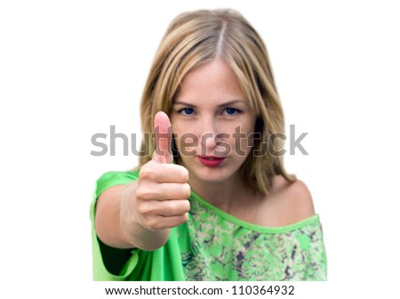 Beautiful woman giving thumbs up for approval