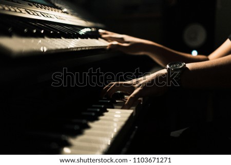 Sound Technician Playing the Keyboard