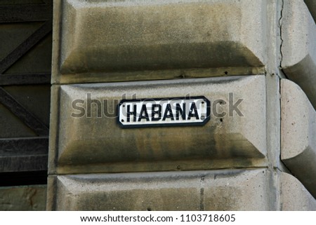 this is a street sign in Havana City, Cuba. The sign is in one of the street intersections with the Obispo boulevard