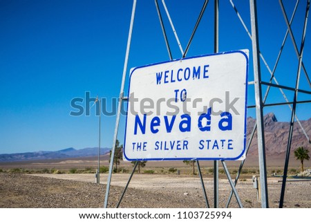"Welcome to Nevada, the Silver State" sign posted at the state line
