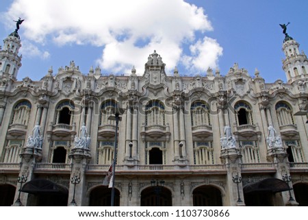 A full frontal shot of Cuba's National Theater Alicia Alonsos. It displays the beautiful baroque architecture of the majestic white building.
