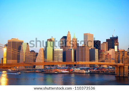 Brooklyn Bridge and Lower Manhattan skyline at sunrise in New York City