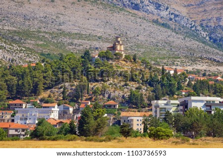 Beautiful landscape with temple on a hillside above the town. View of Trebinje city with  St Michael the Archangel Orthodox Church.  Bosnia and Herzegovina, Republika Srpska