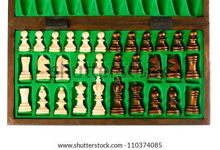 set of wooden chess pieces in green box