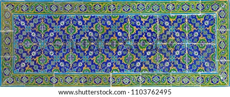 Ancient colorful tiles with oriental pattern close up background. Topkapi palace, Istanbul, Turkey