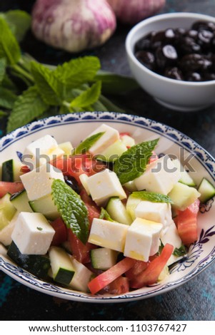 Greek salad with feta cheese cubes and fresk vegetables