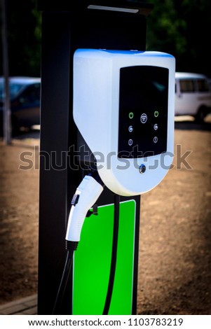 The station is white for refueling an electric car. There is a place for recording at the bottom. Royalty-Free Stock Photo #1103783219