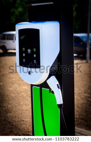 The station is white for refueling an electric car. There is a place for recording at the bottom. Royalty-Free Stock Photo #1103783222