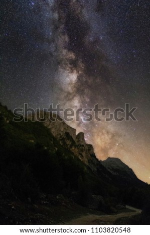 
A milky way over the steep mountains. Night sky in Montenegro, in the mountains of Prokletije.