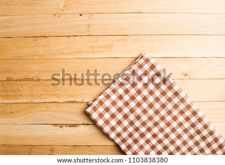 Napkin on the wooden background. Top view.
