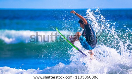 Aron Alvarez, a young promise of Costa Rican surfing. Riding the waves. Costa Rica, surfing paradise. Royalty-Free Stock Photo #1103860886