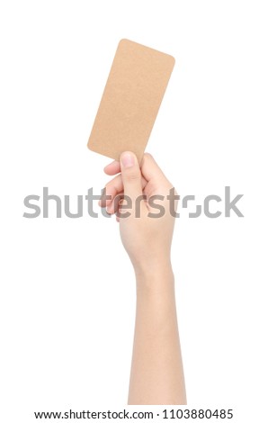 Hand showing a brown card isolated on a white background with clipping path.