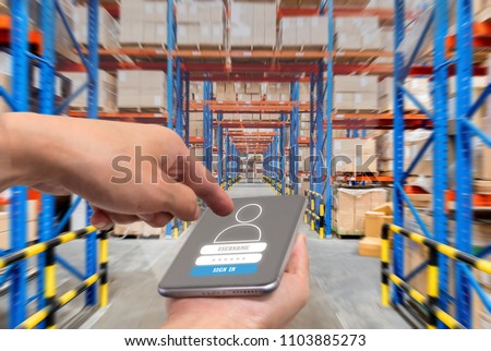 businessman with touchscreen tablet to login application for inspection checking inventory in stock room. Warehouse storage of retail merchandise shop.