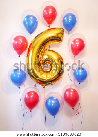 The original decoration of the room for the celebration of the birthday of the boy, who turns 6 years old. Balloons are transparent, red and blue. Ball in the ball. Theme party in the style of "Spider