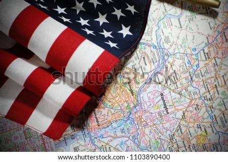 An American flag pictured with a map of Washington D.C.