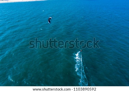 Aerial view of Kitesurfing on the waves of the sea in Mui Ne beach, Phan Thiet, Binh Thuan, Vietnam. Kitesurfing, Kiteboarding action photos