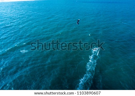 Aerial view of Kitesurfing on the waves of the sea in Mui Ne beach, Phan Thiet, Binh Thuan, Vietnam. Kitesurfing, Kiteboarding action photos
