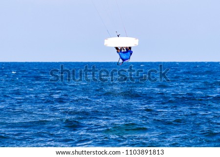 Kitesurfing on the waves of the sea in Mui Ne beach, Phan Thiet, Binh Thuan, Vietnam. Kitesurfing, Kiteboarding action photos