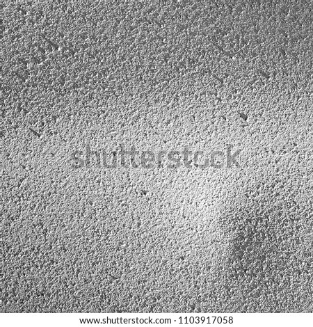 Painted metal surface. Shadows and lights. Abstract decorative background. Black and white colors