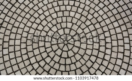 Center view of patio pavers circle design overhead view, Old mosaic from granite at a street