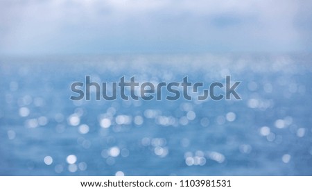 Beautiful abstract blur light on sea and ocean background for summer season
