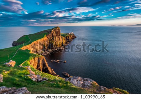 Wonderful sunset at the Neist point lighthouse in Scotland Royalty-Free Stock Photo #1103990165