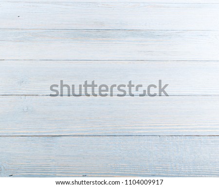 Beautiful vintage pale blue wood background. Light old painted wooden table surface. Rustic light blue pastel desk board or plank texture Royalty-Free Stock Photo #1104009917