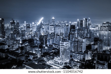 scenic of dark night urban cityscape lighting up metropolis background
