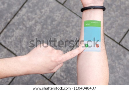 Wearable Projection Bracelet Smartphone Mobile Phone on Man Hand Invisible Tech technology Innovations Future Concept Bussines. Technological Progress Communication. Incoming call. Royalty-Free Stock Photo #1104048407