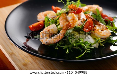Tiger prawns with greens. Seafood salad. close-up Royalty-Free Stock Photo #1104049988