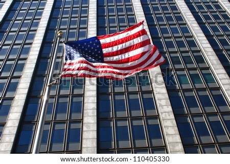 American flag in front of business building
