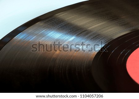 Segment of vinyl record with label close up.