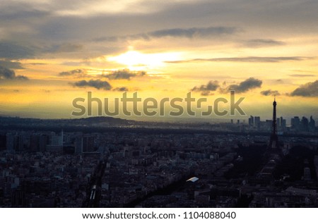 Top view of Paris on the background of the setting sun