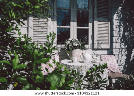 The coffee corner, coffee pot and coffee mug near white window in the afternoon