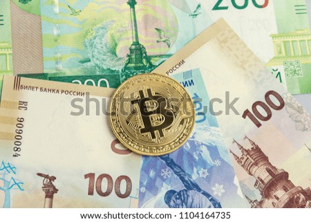 banknotes rubles, one bitcoin