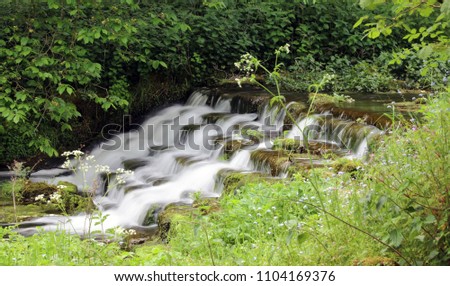Small waterfall in Lathkill Dale, Derbyshire, England