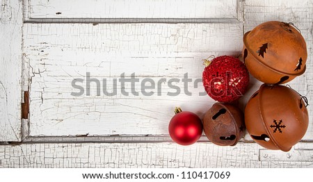 Christmas ornaments on antique cracked wood panel
