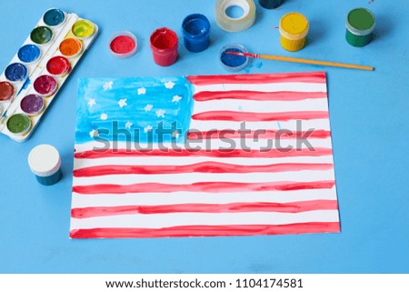 The child painted the American flag