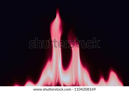 Pink fire and flames on black background