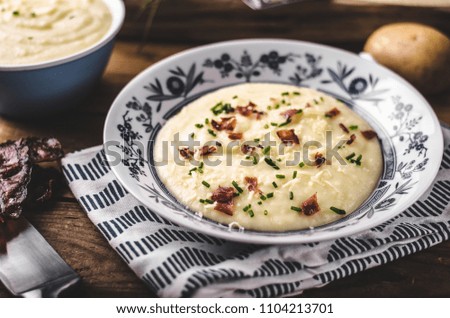 Mashed potatoes, fresh herb and crispy bacon in, food photography, stock food photo