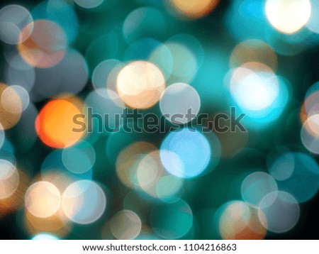 round bright blurred blue and orange round lights on black party background 