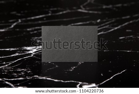 Photo of black business cards on marble. Template for branding identity isolated on marble background. For graphic designers presentations and portfolios marble premium luxury mock-up. 